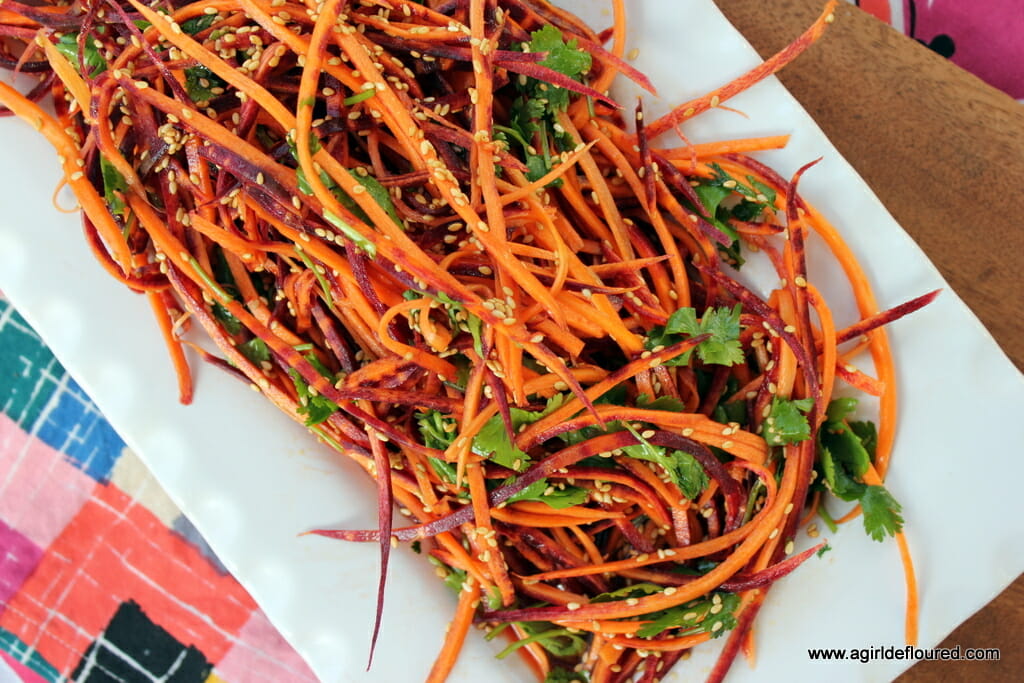 rainbow carrot slaw topped with sesame seeds