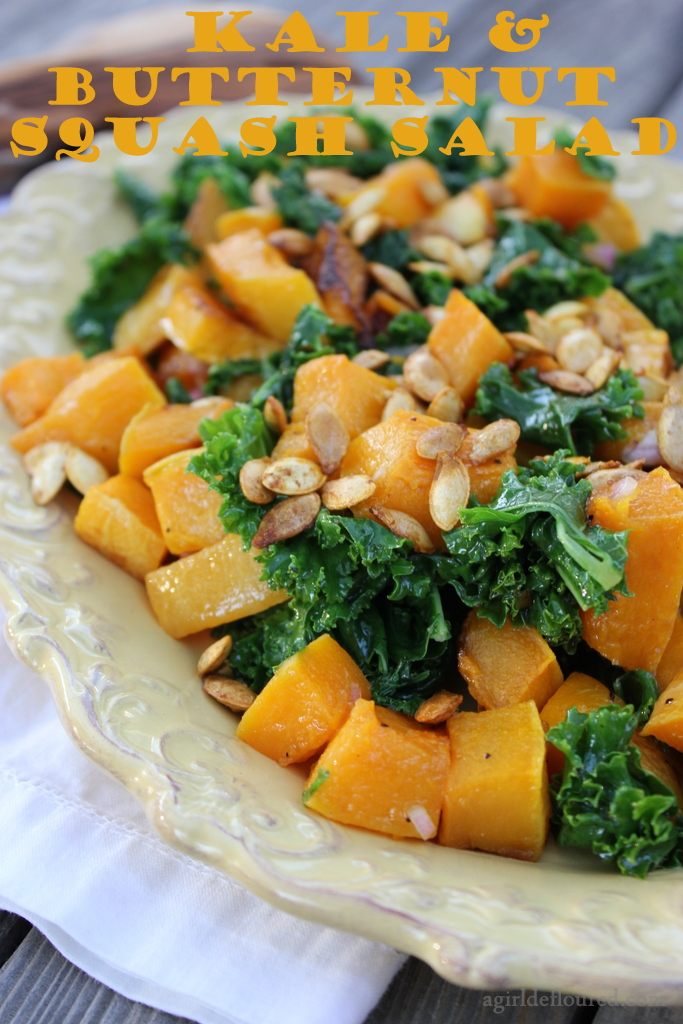 butternut squash and kale salad topped with roasted squash seeds