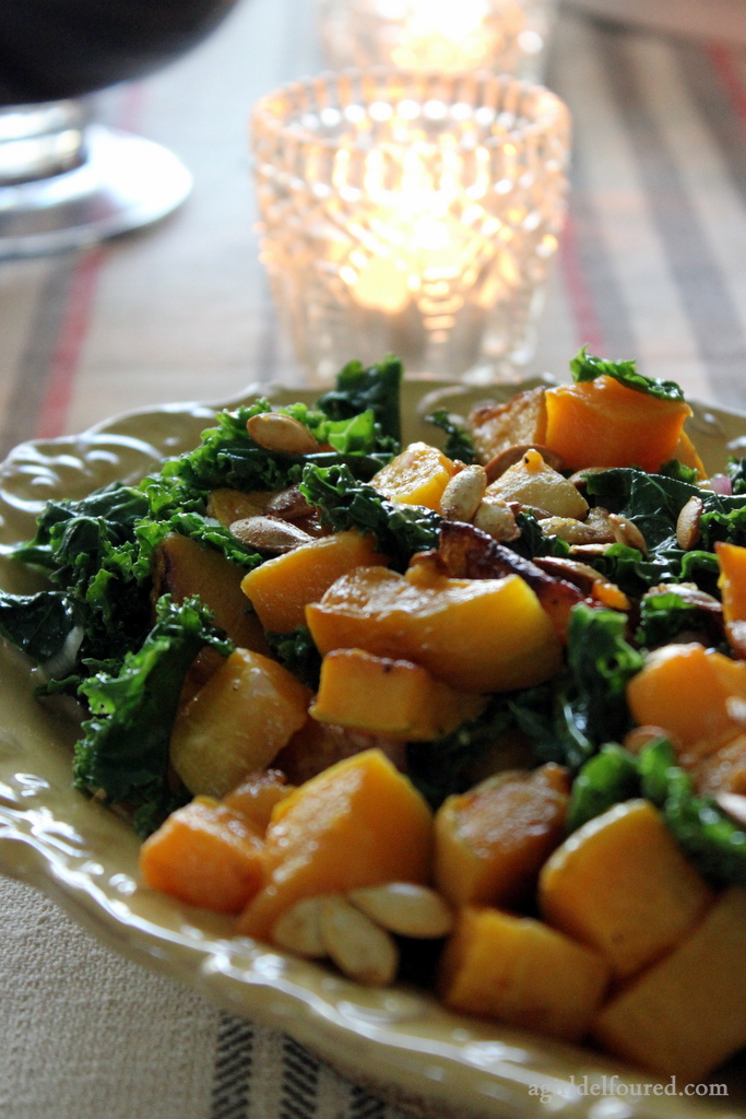 butternut squash and kale salad on the dinner table in candle light