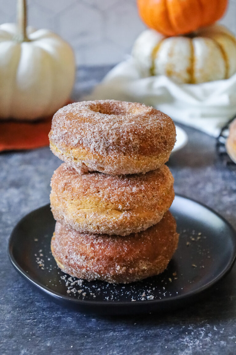 a stack of gluten free pumpkin doughnuts