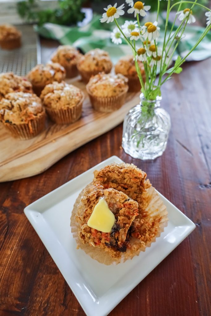 cut carrot cake muffins with butter