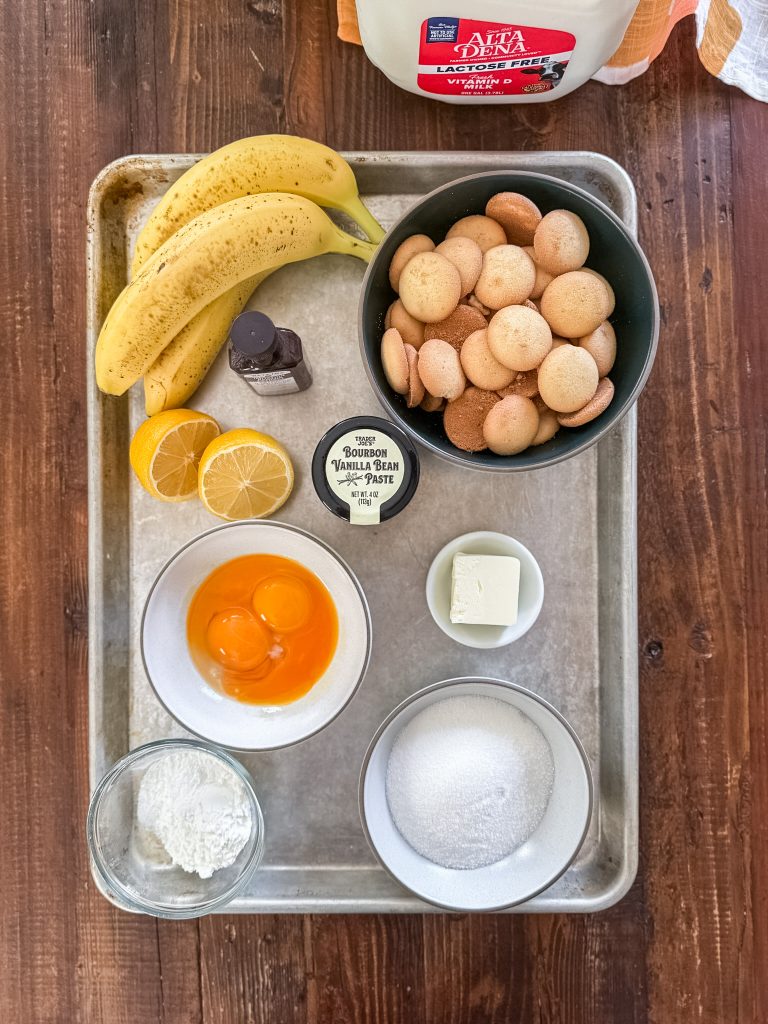 ingredients for banana pudding arranged on a half sheet pan
