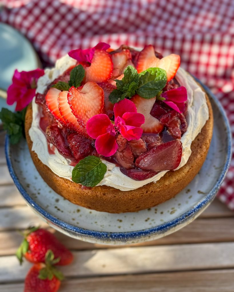 a gluten free buttermilk cake on a speckled blue and white cake stand