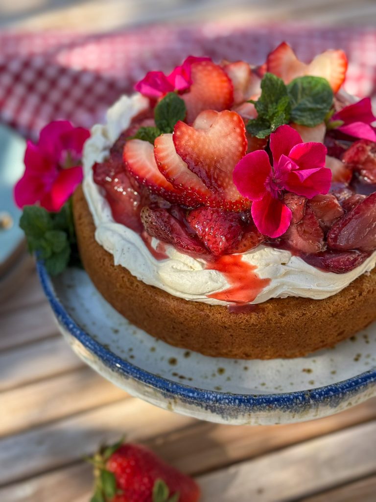 Gluten free buttermilk cake topped with roasted california strawberries and whipped mascarpone